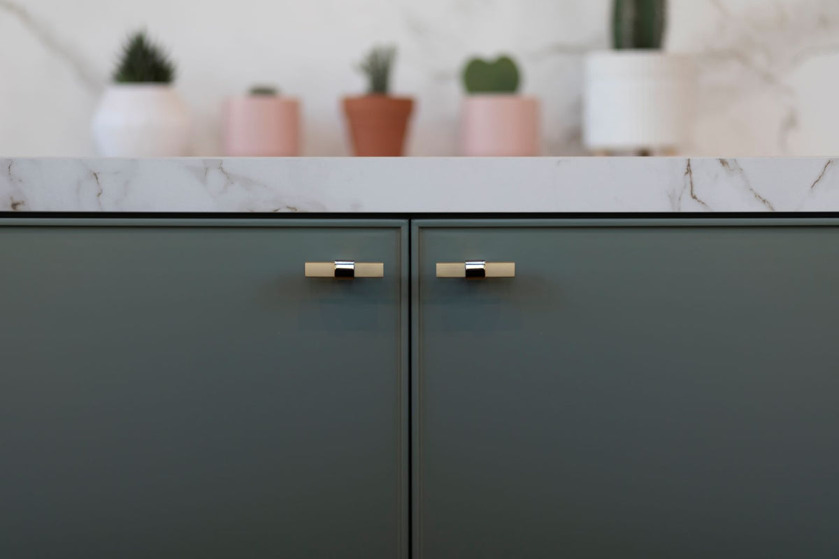Clarity knob in satin brass finish on powder room vanity